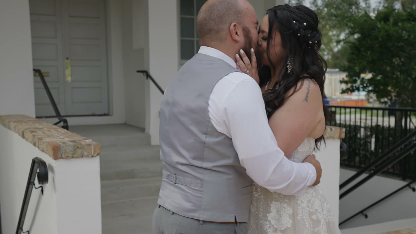 Newlyweds holding each other close